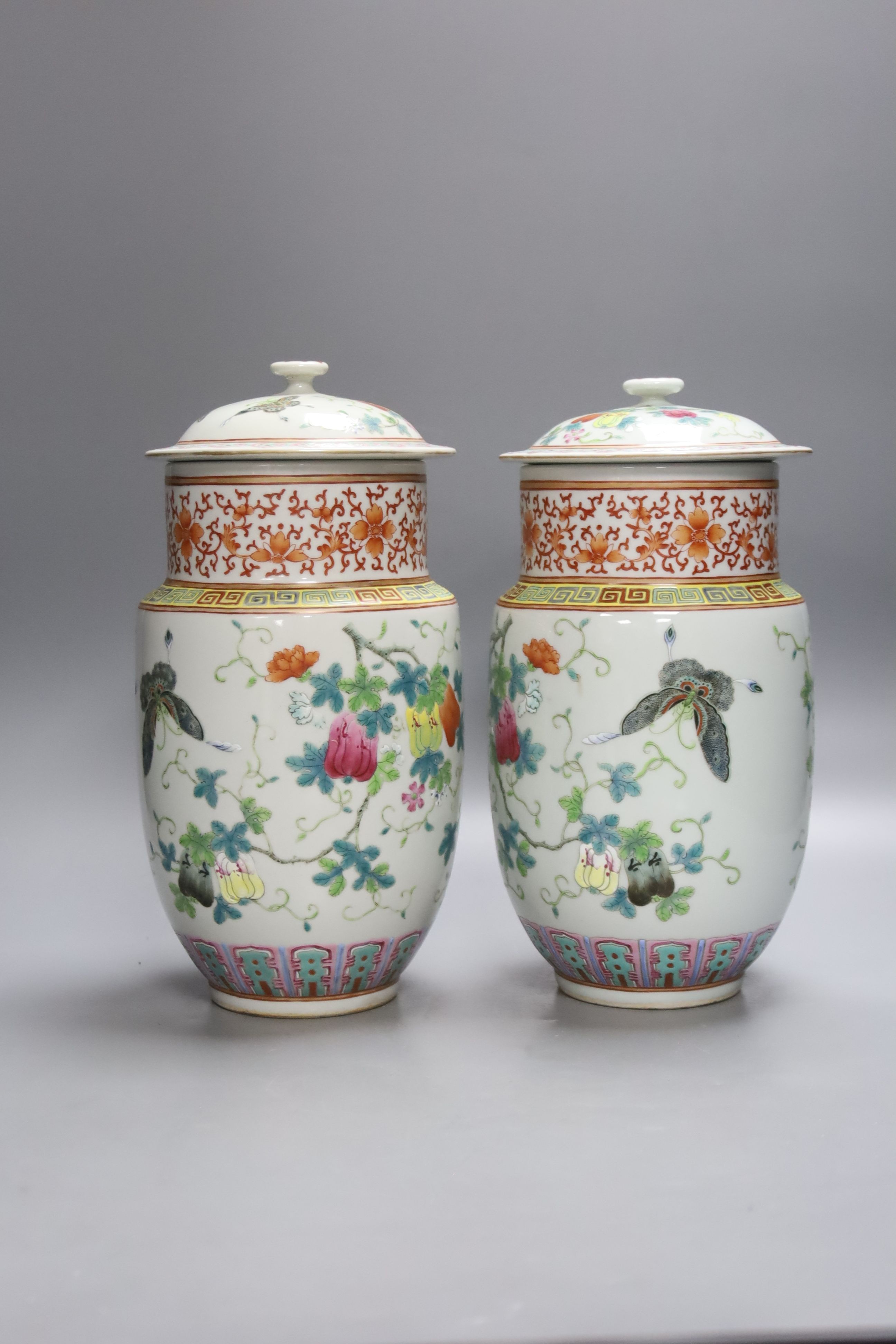 A pair of Chinese famille rose vase and covers, height 26cm